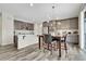 Spacious kitchen with an island, marble counter tops, and a dining table at 4733 S Wenatchee Cir, Aurora, CO 80015