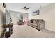 Upstairs loft area with neutral carpeting and seating area at 4733 S Wenatchee Cir, Aurora, CO 80015