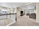 Upstairs loft with carpet, nice natural light and comfortable seating at 4733 S Wenatchee Cir, Aurora, CO 80015