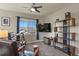 Bedroom featuring two chairs, a bookshelf, and a telescope under a window at 1794 Wright Dr, Erie, CO 80516