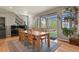 Dining room view features a piano, backyard access, and a wooden table and chairs at 1794 Wright Dr, Erie, CO 80516