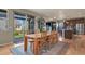 The dining room features a wood table and chairs and a sliding glass door to the backyard at 1794 Wright Dr, Erie, CO 80516