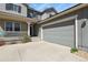 Home exterior with attached garage and covered front porch, adding curb appeal at 1794 Wright Dr, Erie, CO 80516