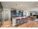 Spacious kitchen features a large island with seating, granite countertops, and stainless steel appliances at 1794 Wright Dr, Erie, CO 80516