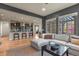 Open-concept living room showcases a modern kitchen with counter seating and a comfortable sofa at 1794 Wright Dr, Erie, CO 80516