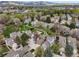 Beautiful aerial view of a neighborhood with mature trees, green spaces, and mountain views in the distance at 4829 Baldwin Pl, Boulder, CO 80301