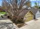 Aerial view of home featuring a landscaped lawn and attached two car garage at 4829 Baldwin Pl, Boulder, CO 80301