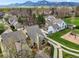 Aerial view of a home with a fenced backyard, landscaping and mountain views at 4829 Baldwin Pl, Boulder, CO 80301