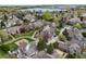 Aerial view of a lakeside community with lush greenery, a playground, and well-maintained homes at 4829 Baldwin Pl, Boulder, CO 80301