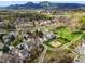 Panoramic aerial shot of a community featuring landscaped grounds, a playground, and stunning mountain backdrop at 4829 Baldwin Pl, Boulder, CO 80301