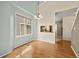 Well-lit dining room with wood-look floors and a view into the kitchen at 4829 Baldwin Pl, Boulder, CO 80301