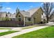 Charming two-story home featuring an arched window and mature landscaping at 4829 Baldwin Pl, Boulder, CO 80301