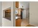 Open kitchen with tile floors and wooden cabinets at 4829 Baldwin Pl, Boulder, CO 80301
