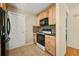 Efficient kitchen offering wooden cabinets and modern appliances at 4829 Baldwin Pl, Boulder, CO 80301