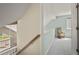 Upstairs landing with cozy rocking chair and view to below at 4829 Baldwin Pl, Boulder, CO 80301