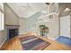 Inviting living room with vaulted ceiling, fireplace, hardwood floors, and upper level view at 4829 Baldwin Pl, Boulder, CO 80301