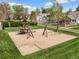 Community playground area with swings, a climbing structure, and a soft landing surface for children at 4829 Baldwin Pl, Boulder, CO 80301