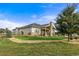 Expansive backyard showcasing a well-maintained lawn, stone chimney and landscaping at 17155 Primrose Ln, Mead, CO 80542