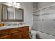 Clean bathroom with a shower/tub combo and wood vanity at 17155 Primrose Ln, Mead, CO 80542