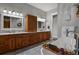 Elegant bathroom with double vanity, soaking tub, and separate shower at 17155 Primrose Ln, Mead, CO 80542