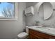 Small bathroom with toilet, sink, and vanity at 17155 Primrose Ln, Mead, CO 80542