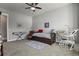 Versatile bedroom with a twin bed, desk, and seating area at 17155 Primrose Ln, Mead, CO 80542