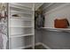 Bright closet with shelves and hanging rods at 17155 Primrose Ln, Mead, CO 80542