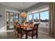Charming dining room with large windows and picturesque views at 17155 Primrose Ln, Mead, CO 80542