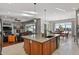 Open concept kitchen with island, views to living area and dining area at 17155 Primrose Ln, Mead, CO 80542