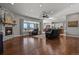 Open living room with hardwood floors, fireplace, and large windows at 17155 Primrose Ln, Mead, CO 80542