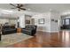 Open concept living room with hardwood floors and views to kitchen at 17155 Primrose Ln, Mead, CO 80542