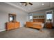 Bright and spacious main bedroom with large windows and a ceiling fan at 17155 Primrose Ln, Mead, CO 80542