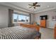 Relaxing main bedroom with a flat screen TV and views at 17155 Primrose Ln, Mead, CO 80542