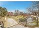 Community park featuring a bridge, pond and waterfall features with townhomes in the background at 8977 E Otero Pl, Centennial, CO 80112