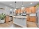 Well-lit kitchen features a center island, granite countertops, and modern stainless appliances at 8977 E Otero Pl, Centennial, CO 80112