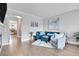 Inviting living room featuring modern decor, hardwood floors, and lots of natural light at 8977 E Otero Pl, Centennial, CO 80112