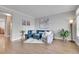 Inviting living room featuring modern decor, hardwood floors, and lots of natural light at 8977 E Otero Pl, Centennial, CO 80112