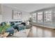 Inviting living room featuring modern decor, hardwood floors, and lots of natural light at 8977 E Otero Pl, Centennial, CO 80112