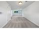 Finished basement offers neutral carpet, and a walkout to the outdoors at 10371 Monterey Cir, Northglenn, CO 80260