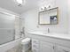 Bright bathroom offers a shower/tub combo, vanity with storage, and updated fixtures at 10371 Monterey Cir, Northglenn, CO 80260