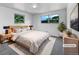Calming bedroom with natural light, plush rug, neutral décor, and comfortable furnishings. (Virtually Staged) at 10371 Monterey Cir, Northglenn, CO 80260