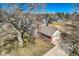 Aerial shot of a charming brick home with a detached garage and large lot with mature trees at 13 Wedge Way, Littleton, CO 80123