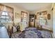 Well-lit home office with large windows, a desk, and ample storage space at 13 Wedge Way, Littleton, CO 80123