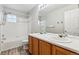 This bathroom features a double vanity, a toilet, and a shower over the bath at 6519 Eastview St, Longmont, CO 80504