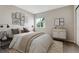 Stylish bedroom features a large window, modern decor, and neutral color palette at 6519 Eastview St, Longmont, CO 80504