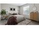 Cozy bedroom features contemporary decor, a large window, and lots of natural light at 6519 Eastview St, Longmont, CO 80504