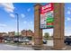 A view of the commercial building with multiple shops including liquor, dining, and Fuel at 6519 Eastview St, Longmont, CO 80504