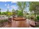 Backyard deck area, with built in seating, and manicured landscaping at 6519 Eastview St, Longmont, CO 80504
