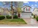 Charming two-story home with a well-manicured lawn, complemented by a red front door and inviting curb appeal at 6519 Eastview St, Longmont, CO 80504