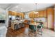 Bright, open kitchen with an island, hardwood floors, and stainless steel appliances at 6519 Eastview St, Longmont, CO 80504